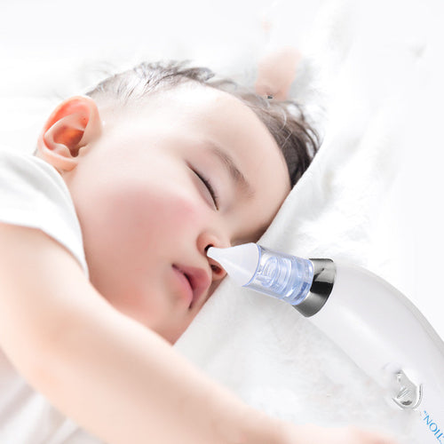 Baby nasal aspirator in use