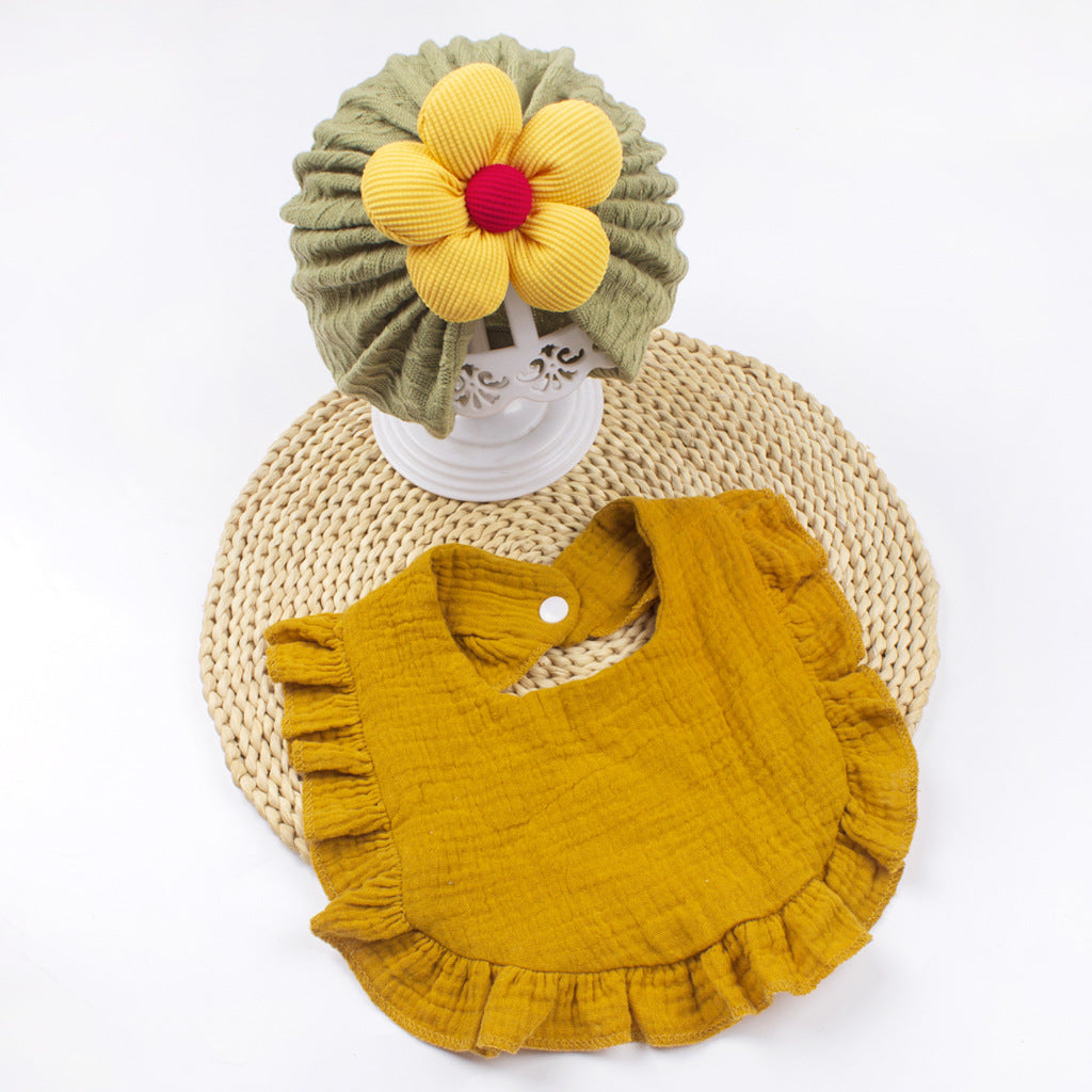 Set de gorro y babero de muselina para reciÃ©n nacido