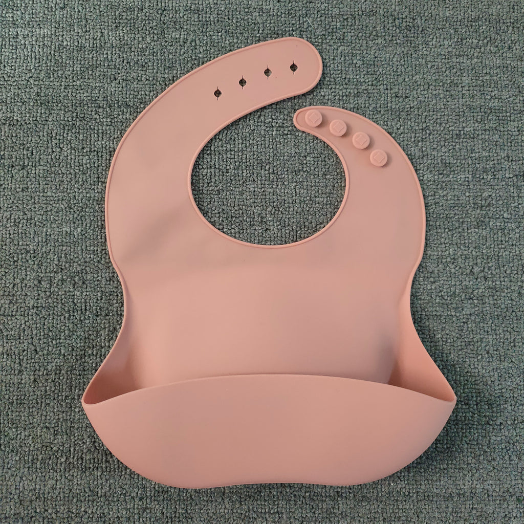 Silicone baby bib with food catcher pocket, pink